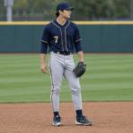 Custom Baseball Uniform – Navy & Gold - on model - Zees Commerce